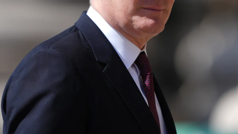 Sir Keir Starmer smiling while walking outside