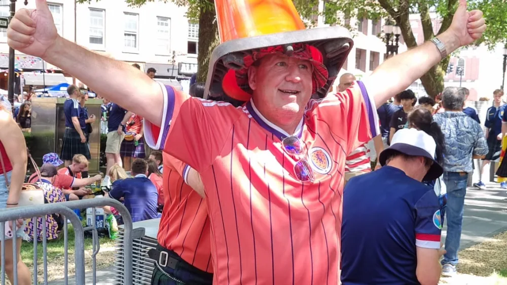 A Scotland fan with a traffic cone on his head in Boston before Friday night’s game (Ryan McDougall/PA).