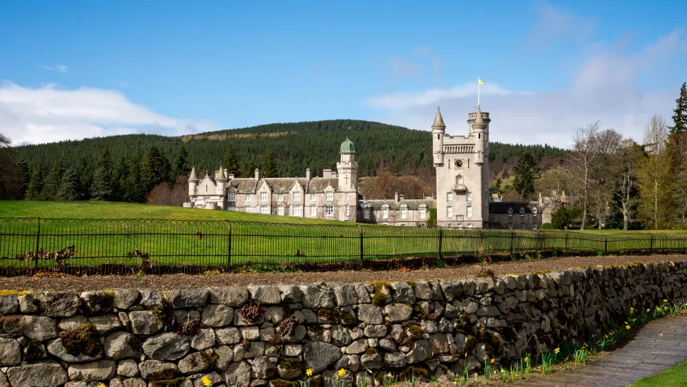 A view of Balmoral Castle, under blue skies
