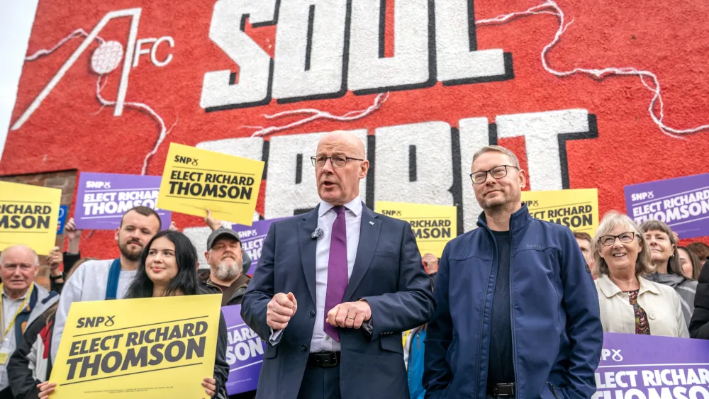 First Minister and SNP leader John Swinney, centre left, campaigning in the Aberdeen South by-election
