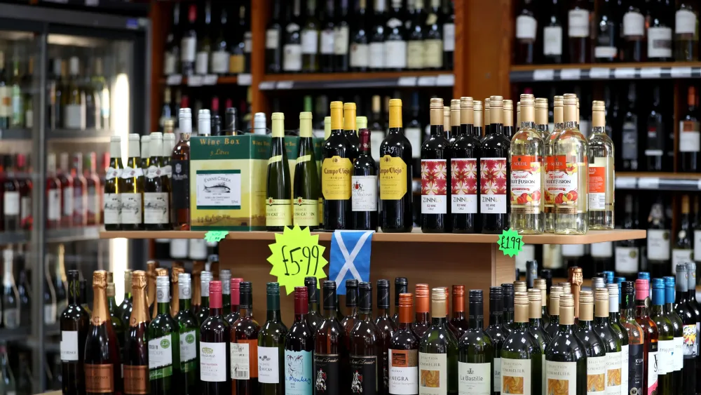 A number of bottles of spirits in an off-licence display