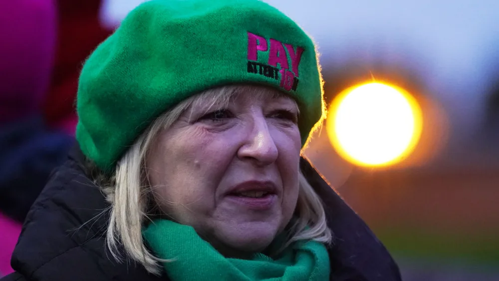 Andrea Bradley stands on a protest line