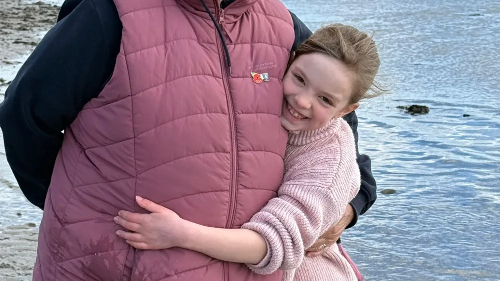 Anne Head hugs her grand-daughter