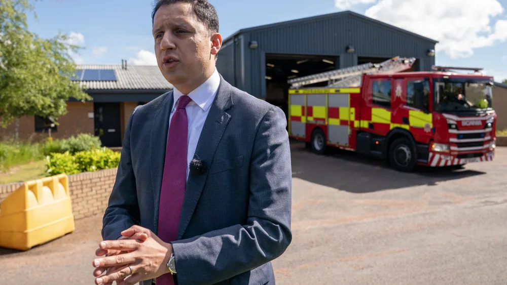 Anas Sarwar speaking while standing outside a fire station