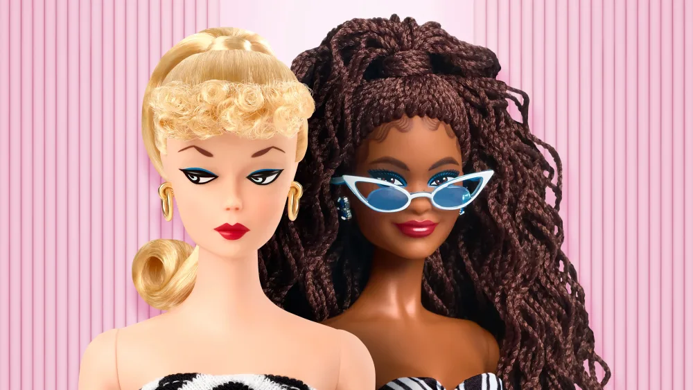 Two Barbie dolls next to each other