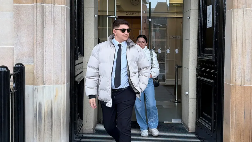Ilia Belov and Nadjedzha Belova leaving a court building