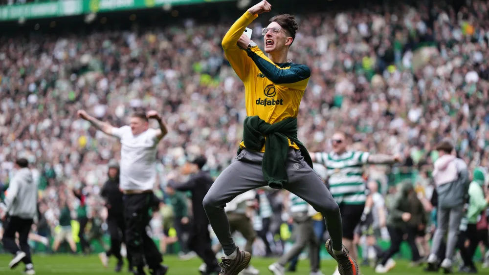 Fans on the pitch at a Celtic game
