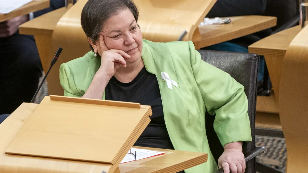 Dame Jackie Baillie seated in Holyrood