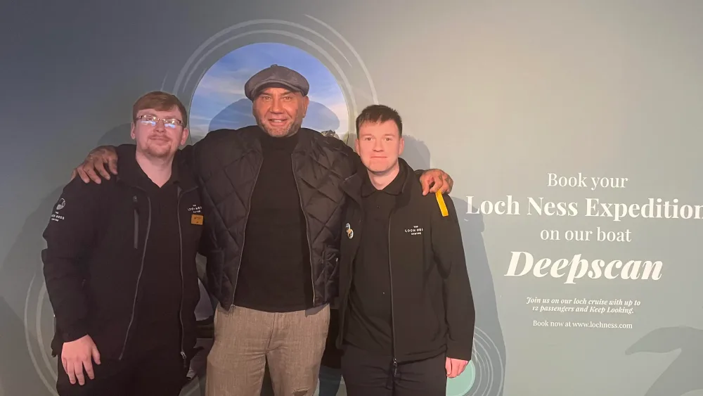 Dave Bautista with workers at the Loch Ness Experience