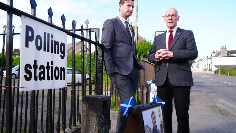 Dave Doogan and John Swinney standing outside a polling station