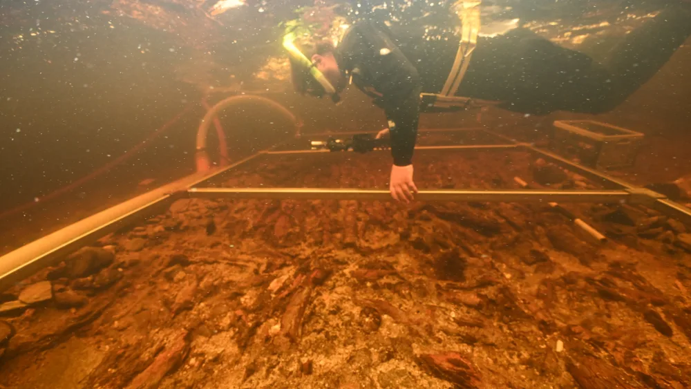 Diver carrying out underwater survey work