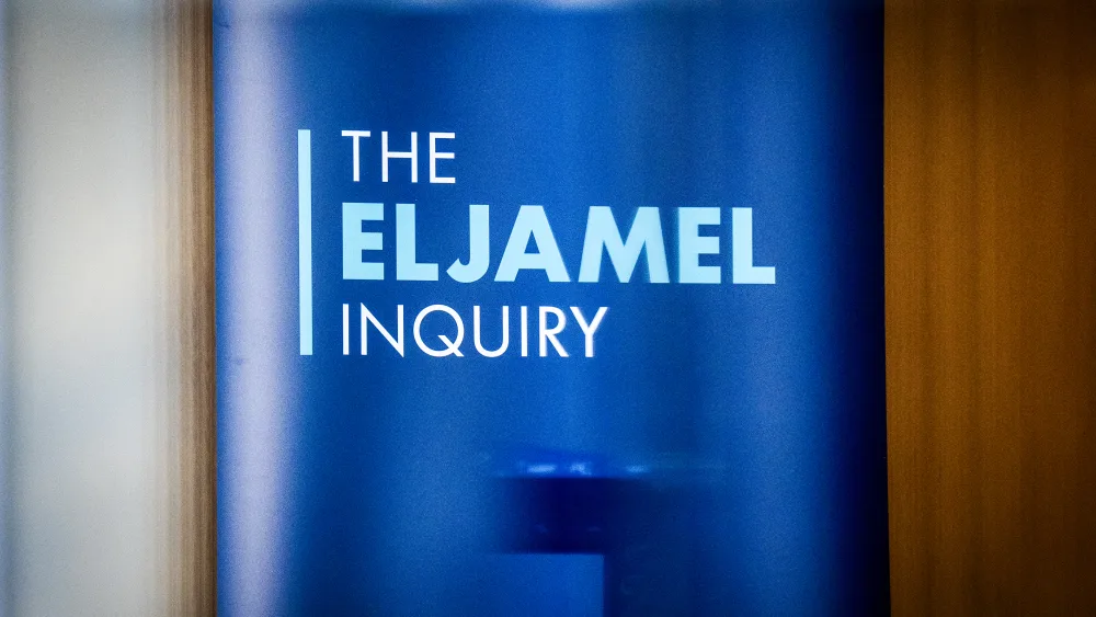 A blue Eljamel Inquiry sign