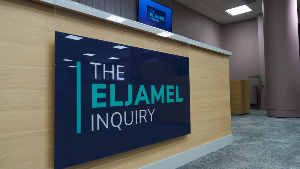 A sign reading 'The Eljamel Inquiry'