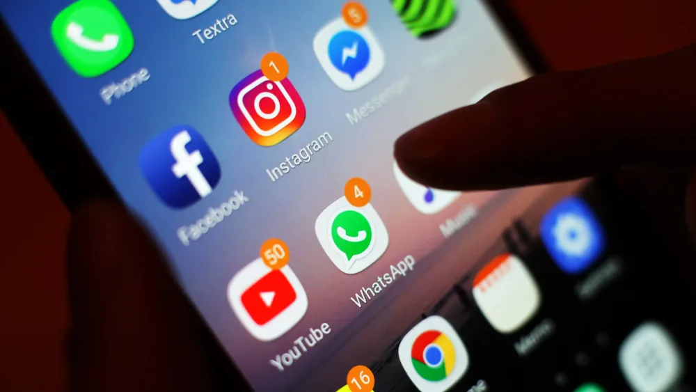 Someone checking their socials on a smartphone