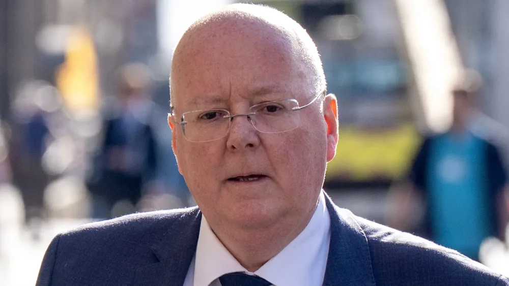 Headshot of Peter Murrell walking outside