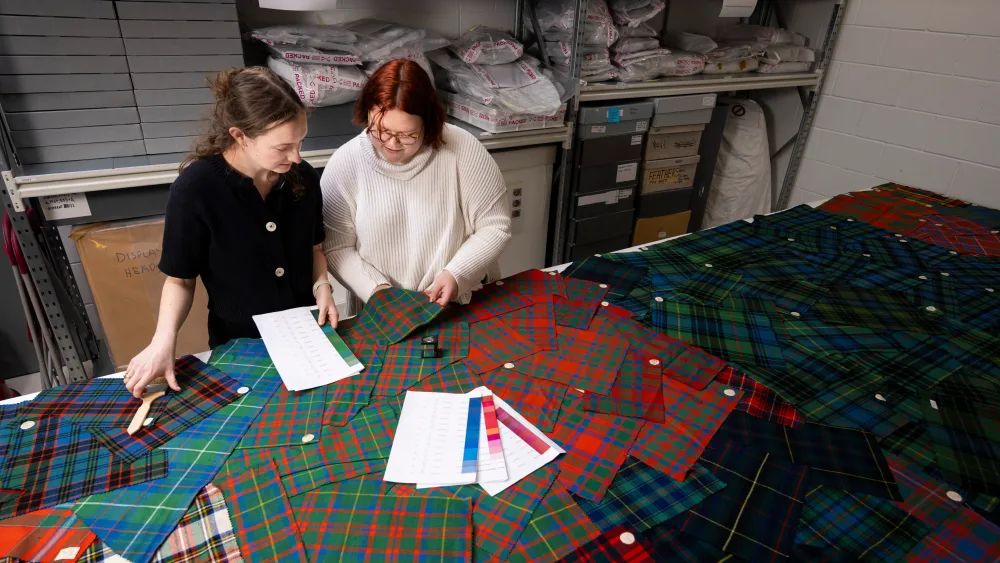 Two students with tartan samples