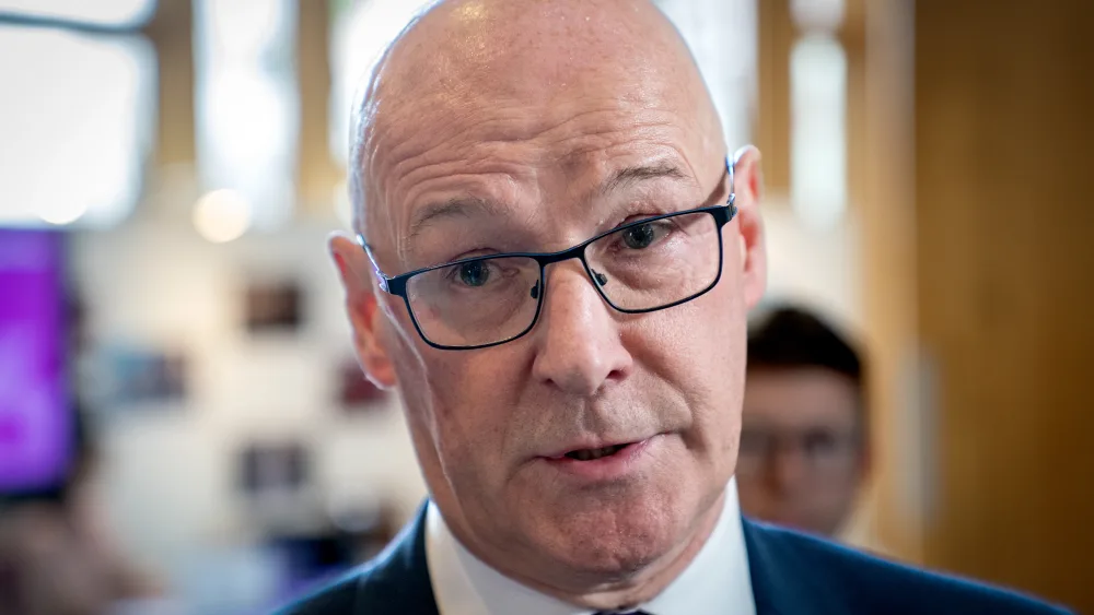 Headshot of John Swinney speaking
