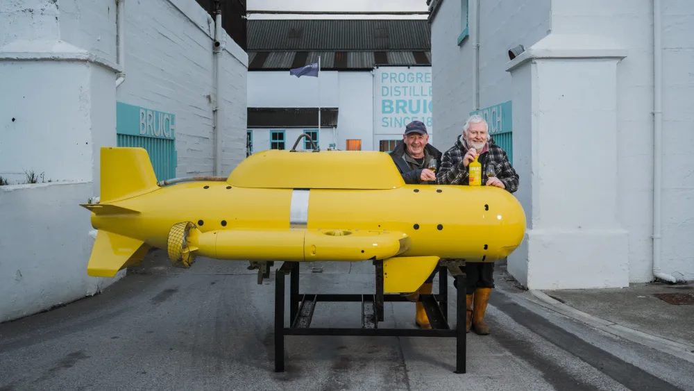 John Baker (left) and Harold Hastie with a replica of the yellow submarine