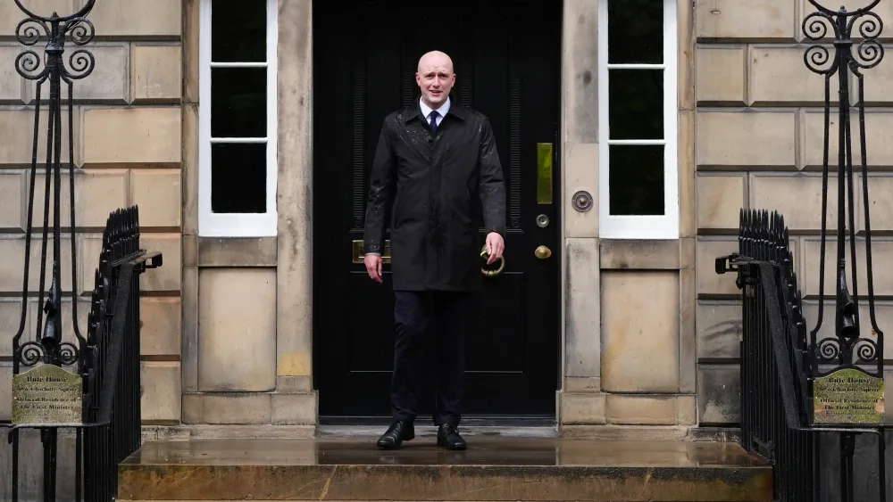 Stephen Flynn standing at the entrance to Bute House