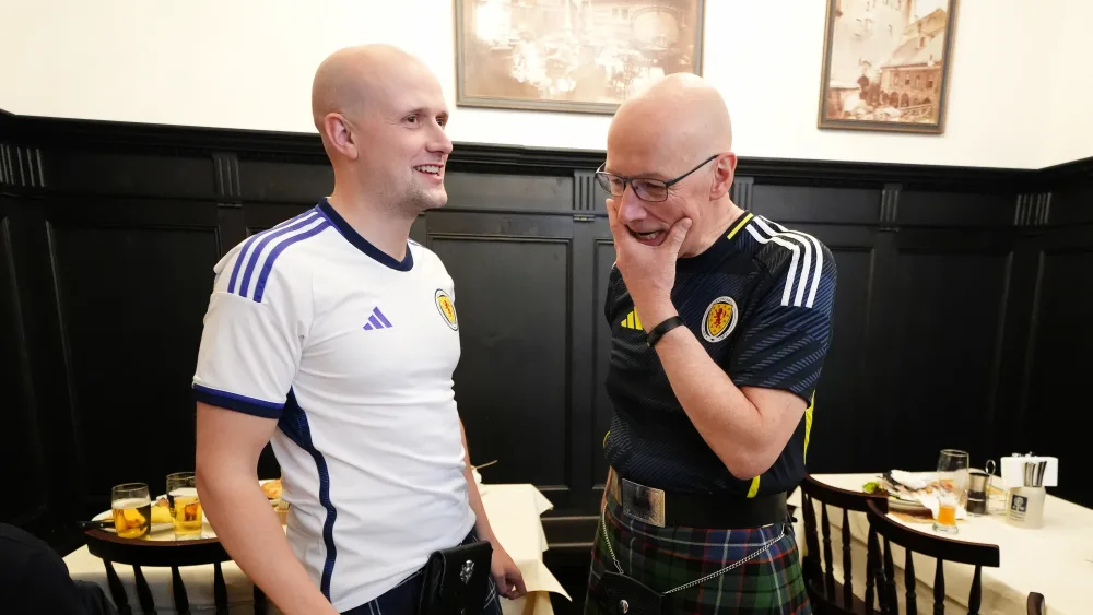 Stephen Flynn and John Swinney wearing Scotland shirts