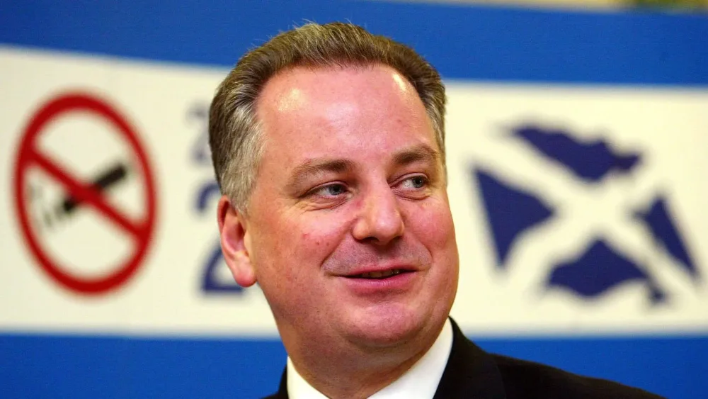 Former first minister Jack McConnell at Edinburgh Airport on March 26 2006 - the start of the smoking ban
