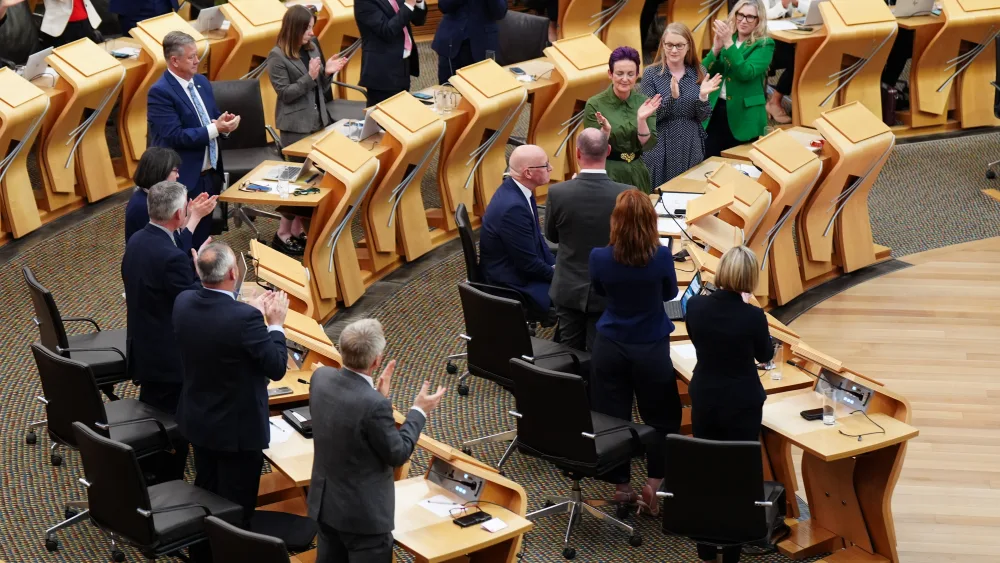 MSPs clap as John Swinney is re-elected as First Minister at the Scottish Parliament in Edinburgh 