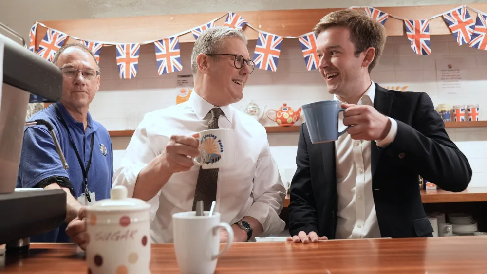 Sir Keir Starmer has a drink with Labour candidate, now MP, Tom Rutland on the campaign trail in 2024 