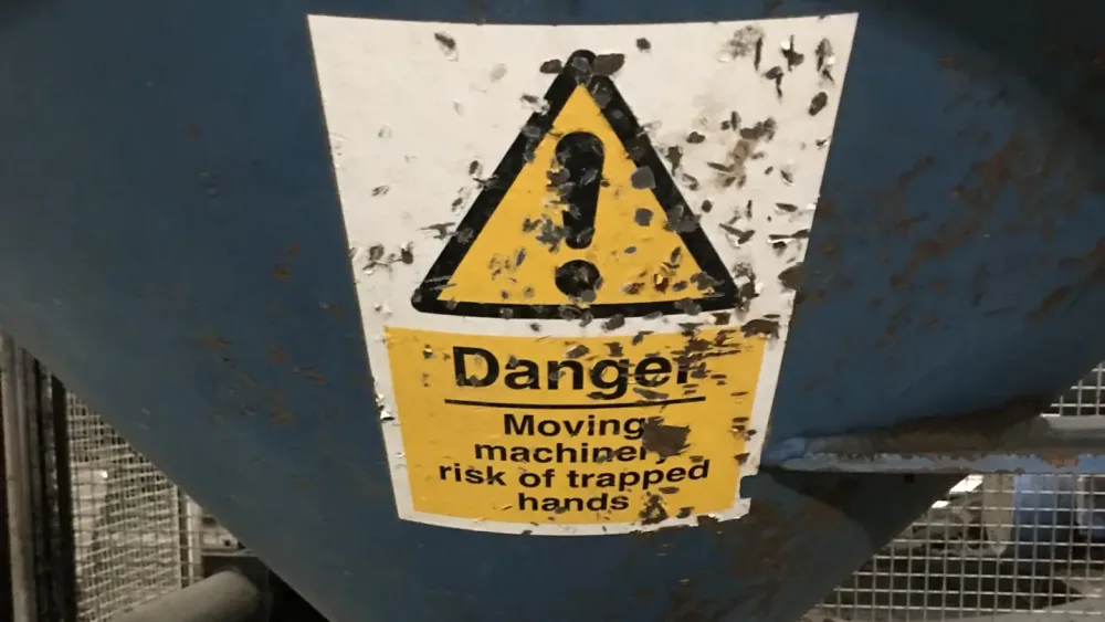 A piece of machinery with a danger sticker