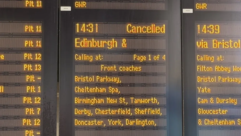 An electronic departures board advising passengers of cancelled trains