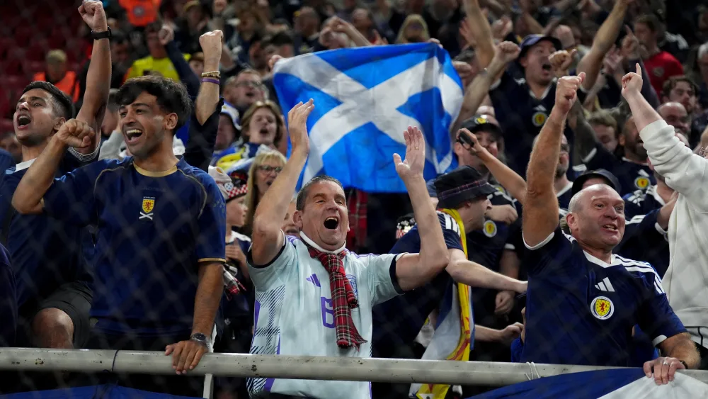 Fans in the crowd at the Greece v Scotland World Cup European qualifier at Georgios Karaiskakis Stadium