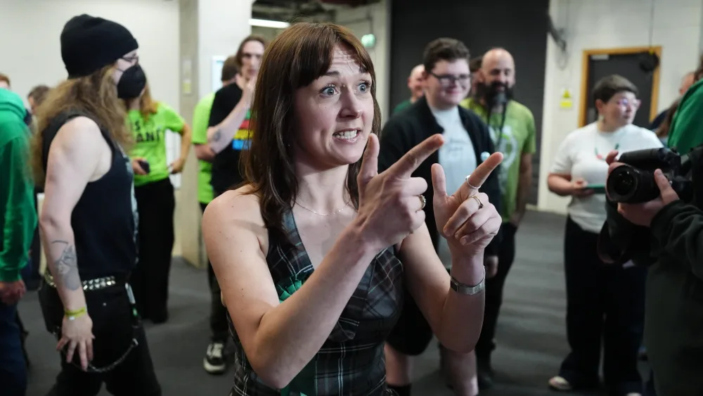 Holly Bruce speaks to the media