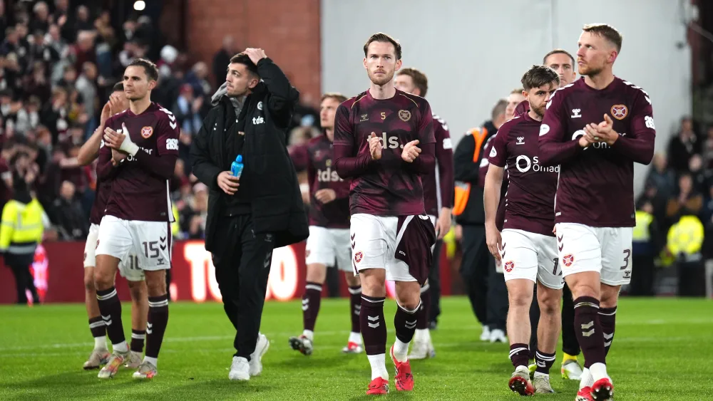 Hearts player applaud fans as they walk around the Tynecastle pitch