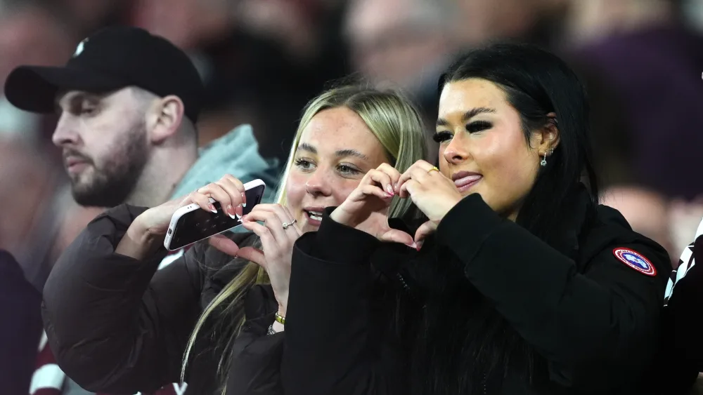 Heart of Midlothian fans do a heart pose with their hands during the William Hill Premiership match at Tynecastle Park, Edinburgh