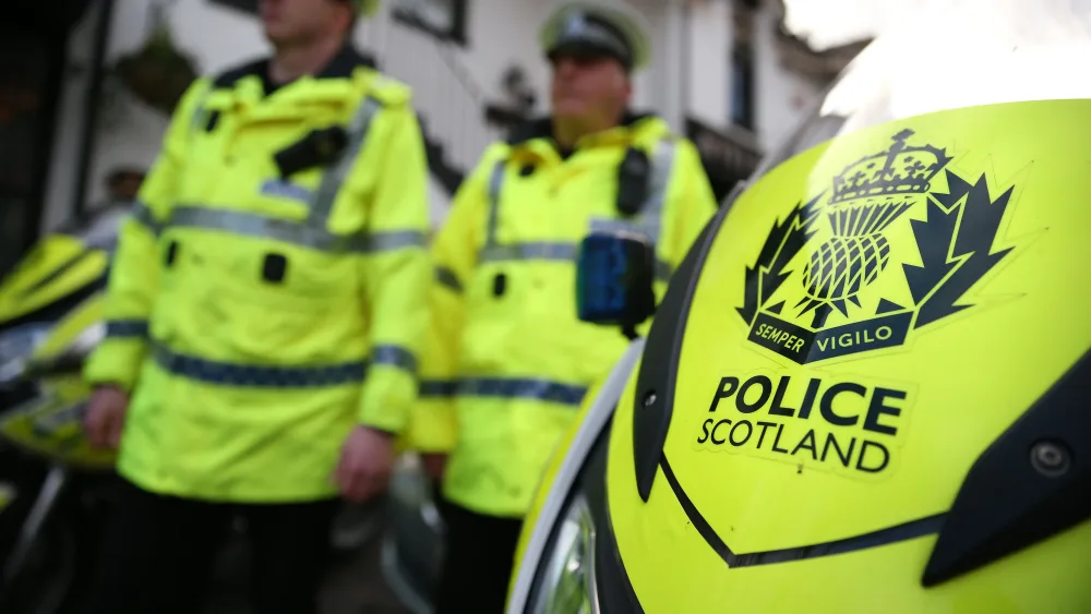 Police Scotland officers and motorbike