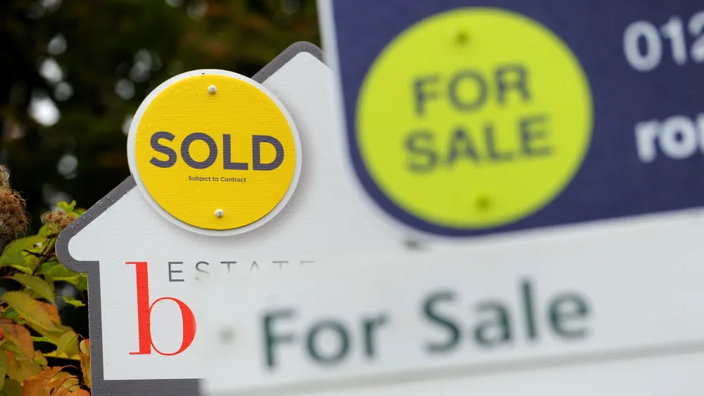 A sold and for sale signs