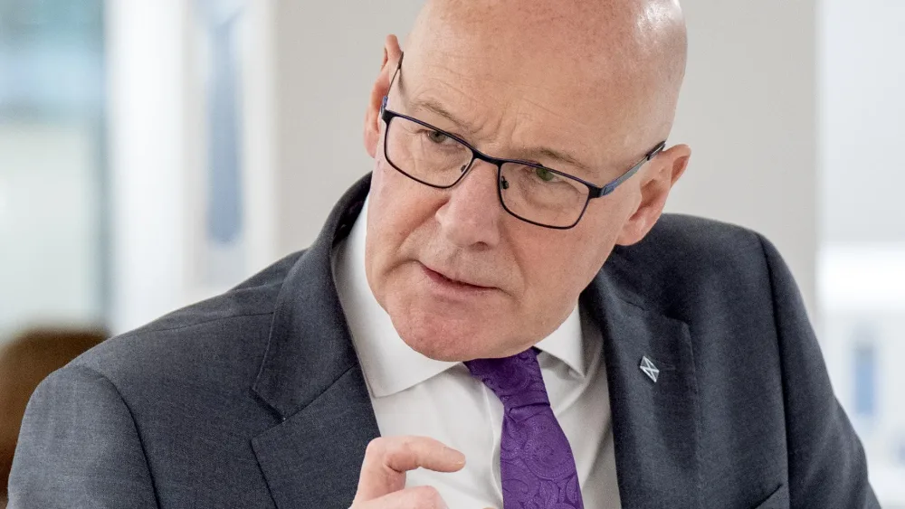 John Swinney talks to staff during a visit to the Western General Hospital in Edinburgh