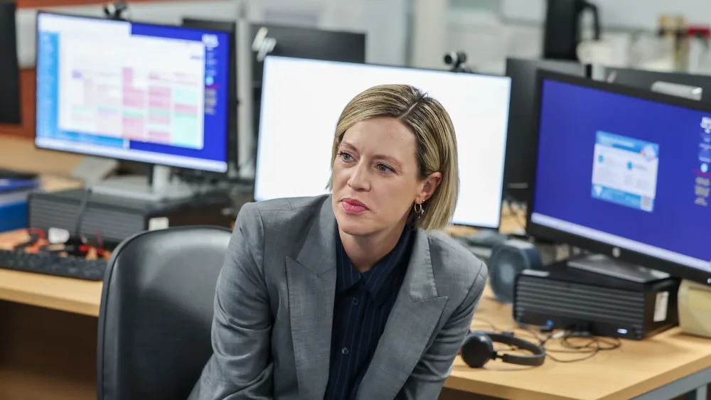 Jenny Gilrith listens to staff during a visit to an NHS hub