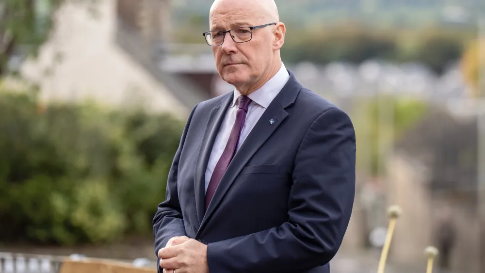 John Swinney standing outside