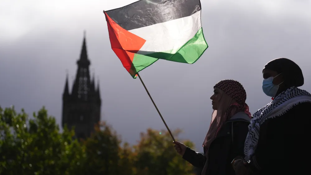 People take part in a pro-Palestine protest outside the University of Glasgow Library, on the third anniversary of Hamas’s October 7 attacks