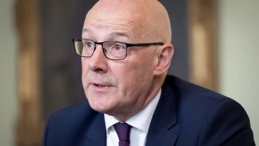 Head and shoulders photo of John Swinney talking