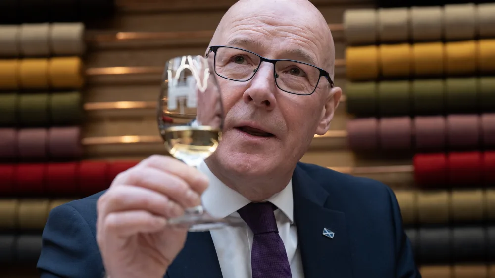 John Swinney with a glass of whisky