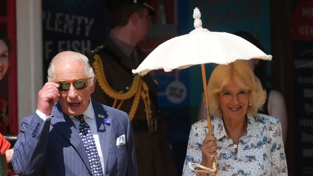 The King and Queen walking side by side