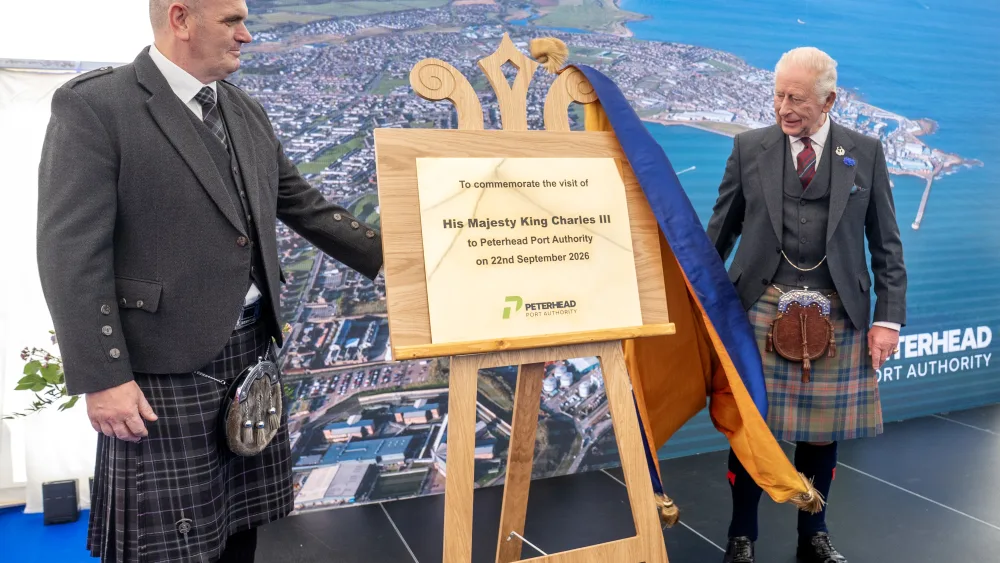 King Charles unveiling a plaque
