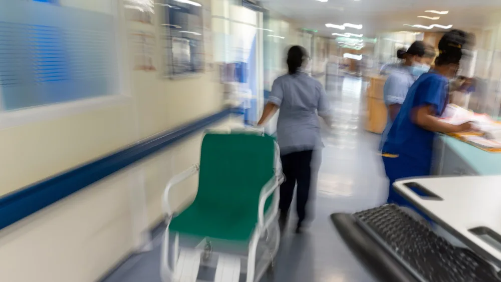 Blurred image of busy hospital corridor