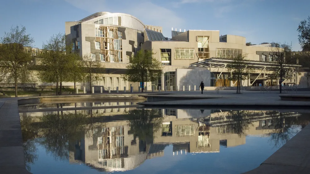 The Scottish Parliament in Edinburgh, reflected on water