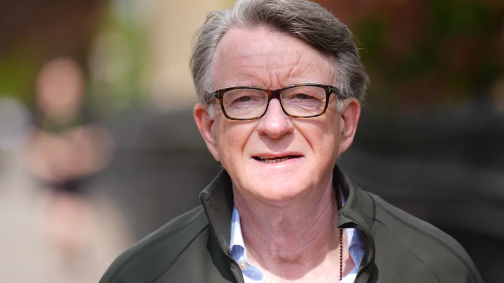 Lord Peter Mandelson looks at the camera