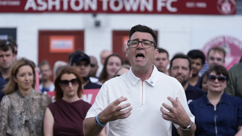 Andy Burnham delivers a victory speech after his by-election win