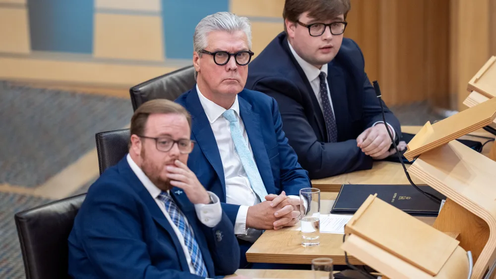 Malcolm Offord and Thomas Kerr seated in the Holyrood chamber