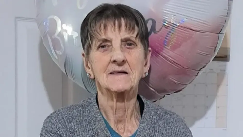 Handout photo of Elizabeth Colligan, with a large balloon behind her