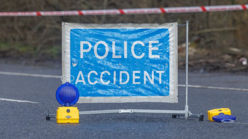 A view of a police accident sign on a road